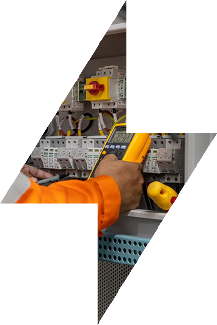 Electrician testing an electrical distribution board with a meter